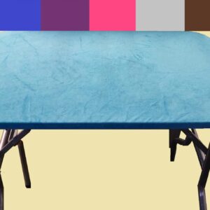 Blue massage table with black folding legs on a white background.