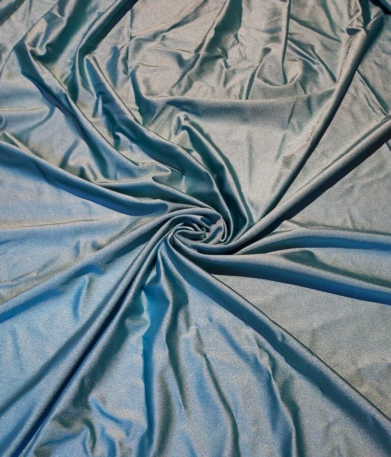 Smooth blue satin fabric with elegant folds and a central swirl