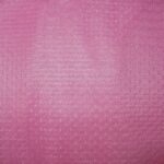 Pink textured fabric with subtle pattern.