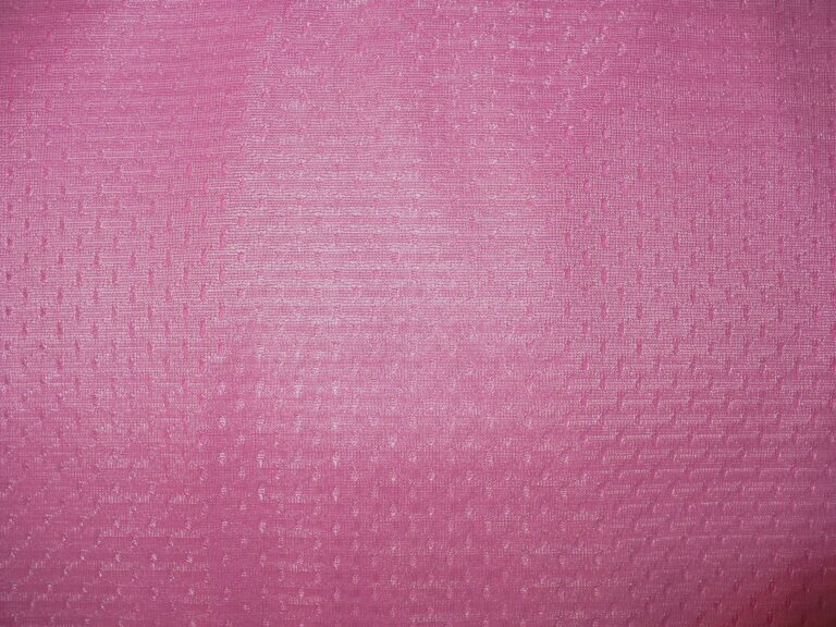 Pink textured fabric with subtle pattern