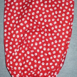 Red fabric with white floral pattern and gathered edge.