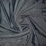 Dark fabric twisted in spiral pattern.