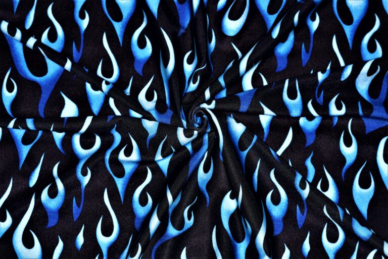 Blue flame pattern on black fabric background