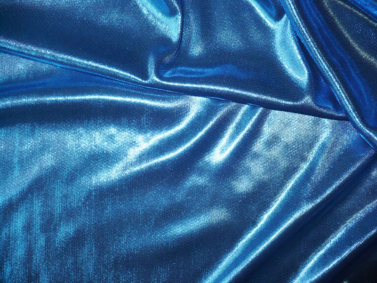 Shiny blue satin fabric with folds
