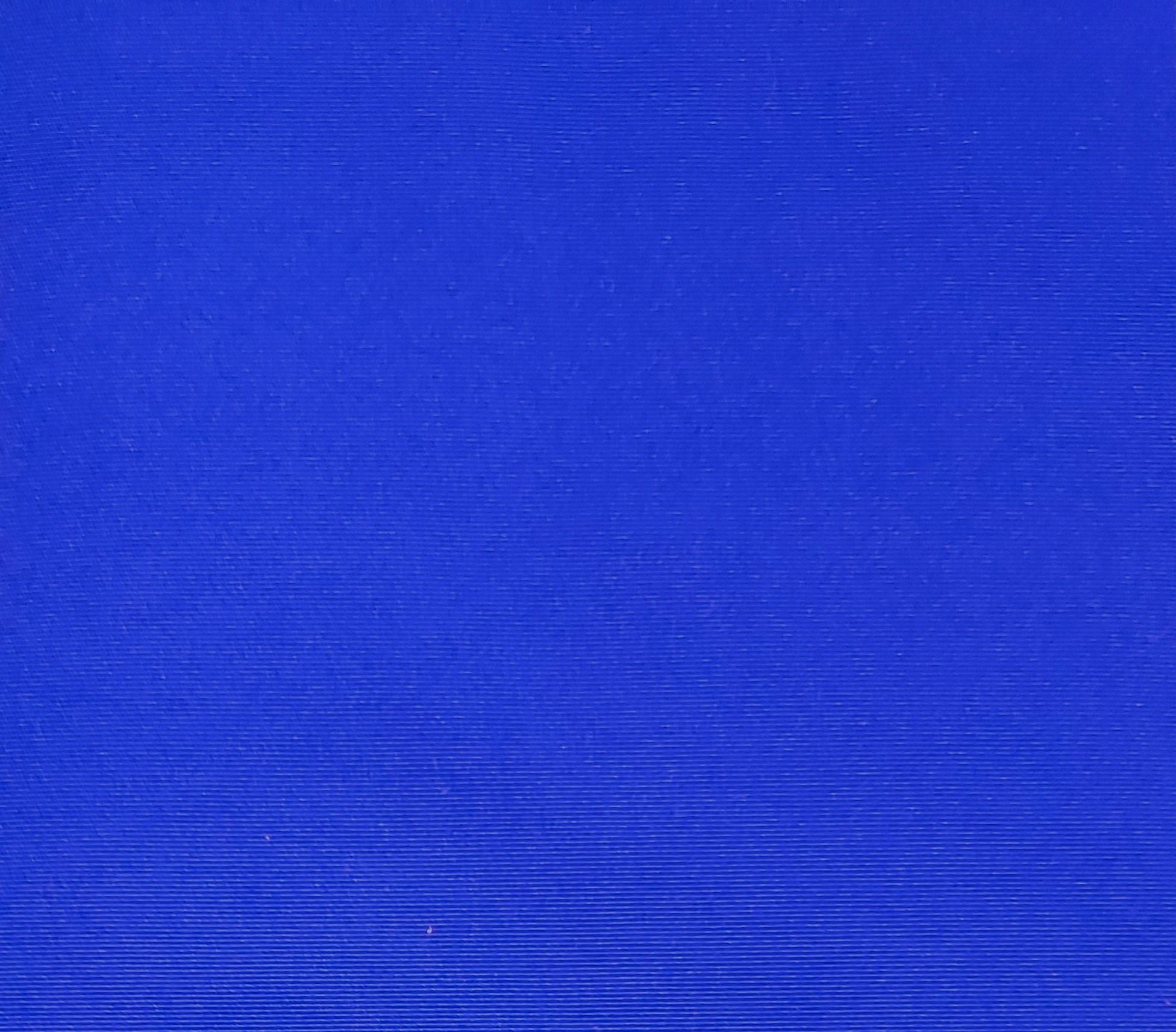 Solid blue textured background.