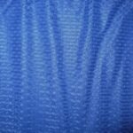 Blue textured fabric with subtle patterns.