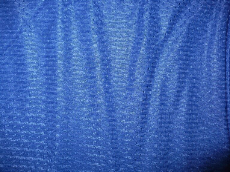 Blue textured fabric with subtle patterns
