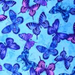Purple and blue butterflies on light background.