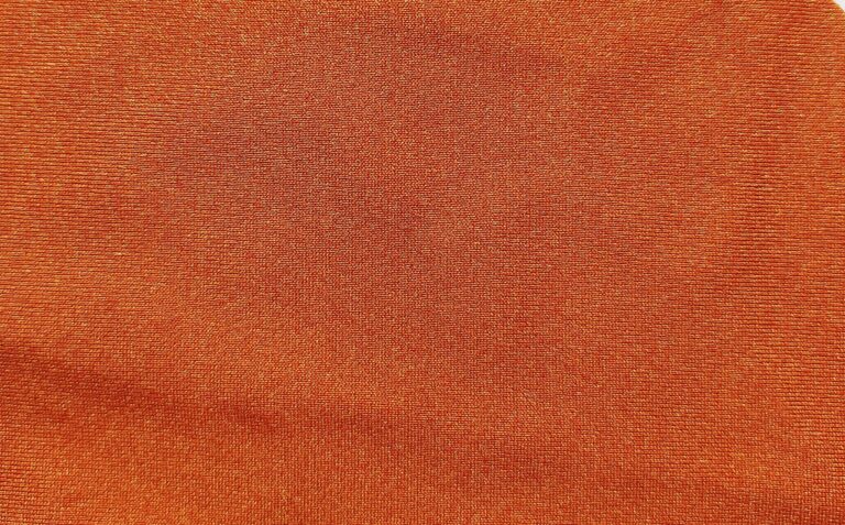Orange textured fabric close-up view