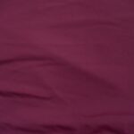 Wrinkled maroon fabric with soft texture.