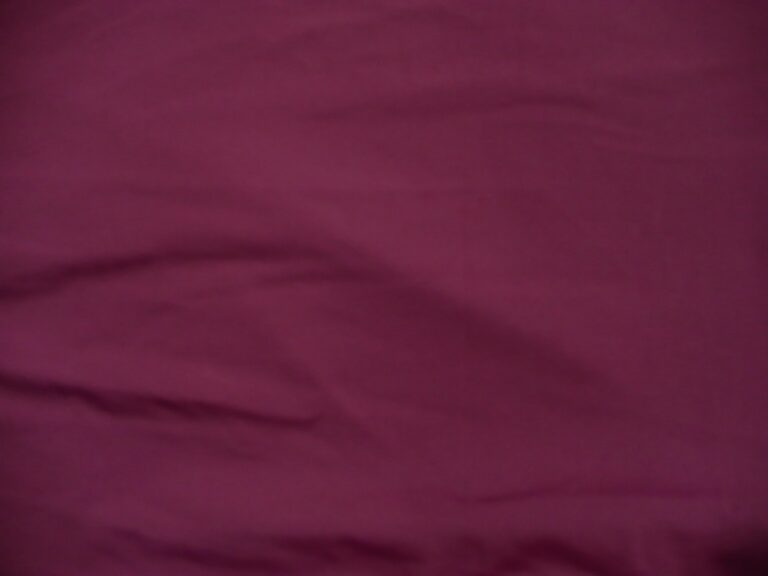 Wrinkled maroon fabric with soft texture