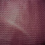 Maroon textured fabric with subtle pattern.