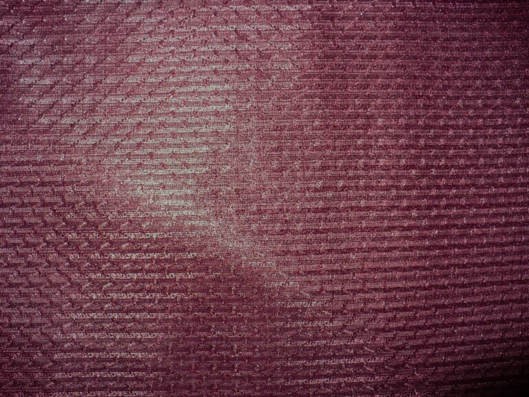 Maroon textured fabric with subtle pattern