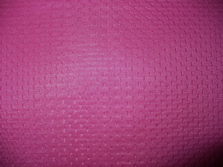 Pink textured fabric with small patterns