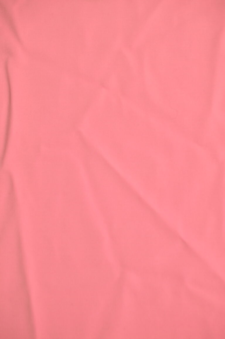 Pink fabric with subtle creases and folds