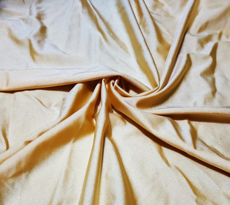 Cream-colored satin fabric with soft folds