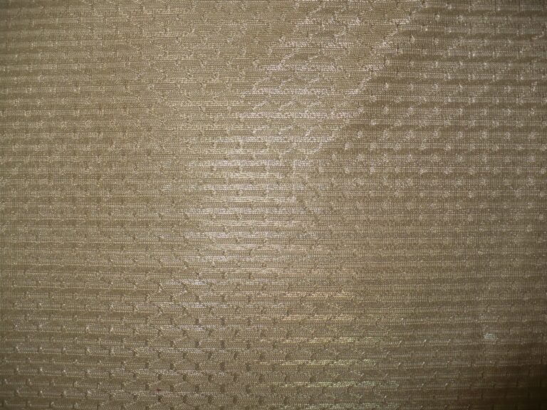 Beige textured fabric close-up view
