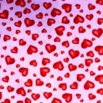 Red hearts pattern on pink background.