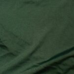 Dark green fabric with subtle texture.