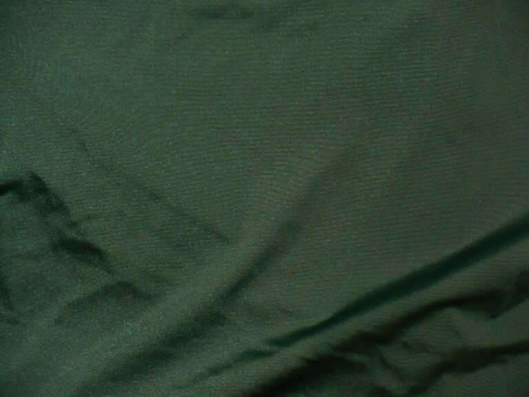 Dark green fabric with subtle texture