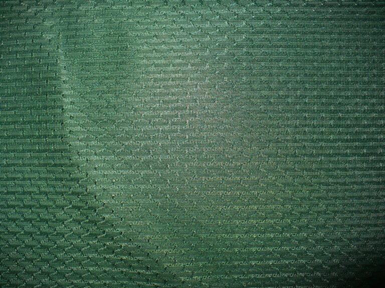 Green textured fabric with woven pattern