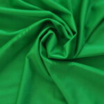Green fabric with a swirling pattern.