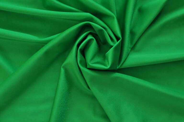 Green fabric with a swirling pattern
