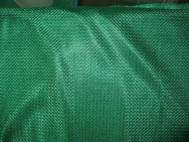 Green textured fabric with subtle pattern