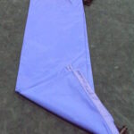 Light purple pants folded neatly on the floor.