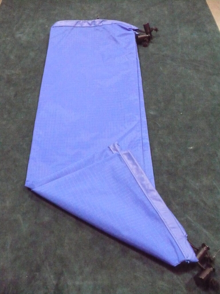 Light purple pants folded neatly on the floor