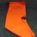 An orange fabric sleeve with a black bat decoration.