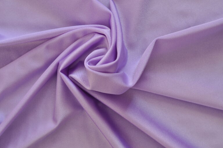Purple fabric with elegant folds and texture