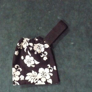 Black and white floral fabric pouch with a black strap.