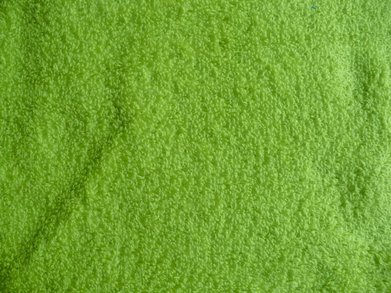 Green textured towel fabric close-up