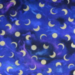 Blue fabric with golden moons and circles.