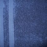 Blue textured fabric with two vertical stripes.