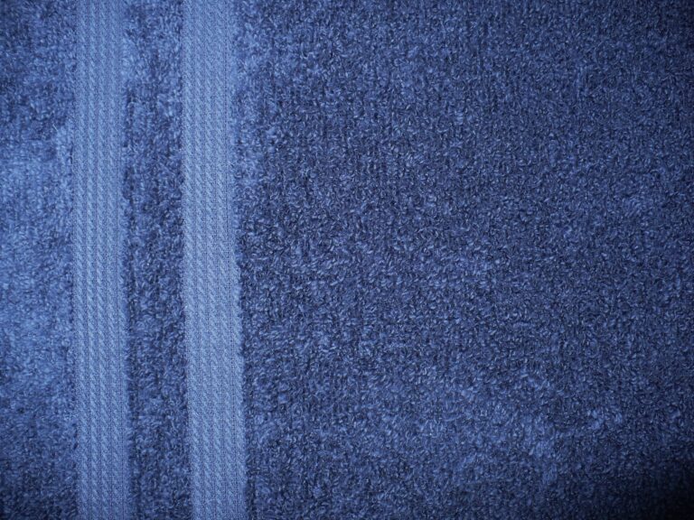 Blue textured fabric with two vertical stripes