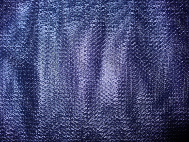 Blue textured fabric with woven pattern
