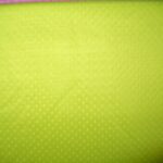 Bright yellow textured fabric close-up.