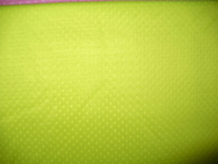 Bright yellow textured fabric close-up