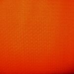 Orange textured fabric with subtle pattern.