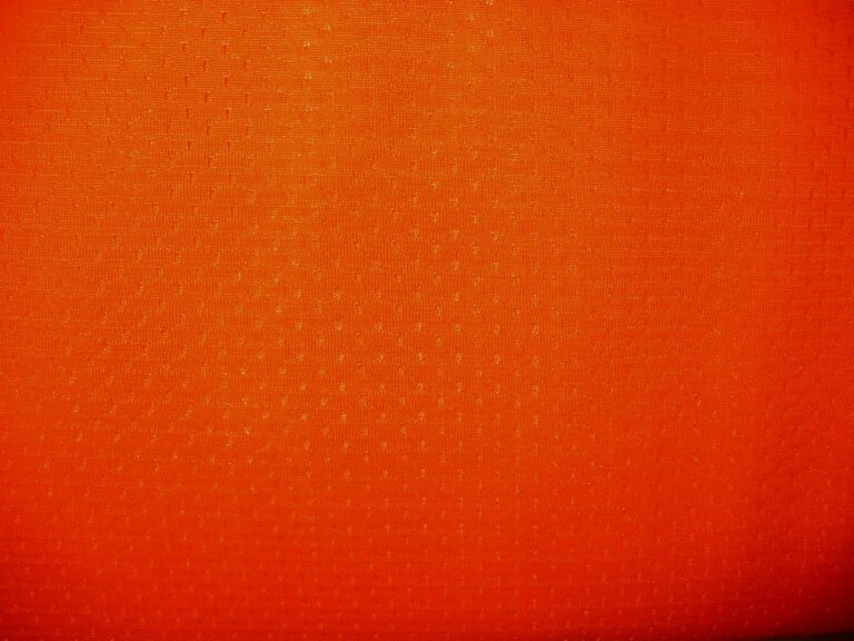 Orange textured fabric with subtle pattern