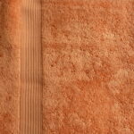 Orange textured towel with striped pattern.