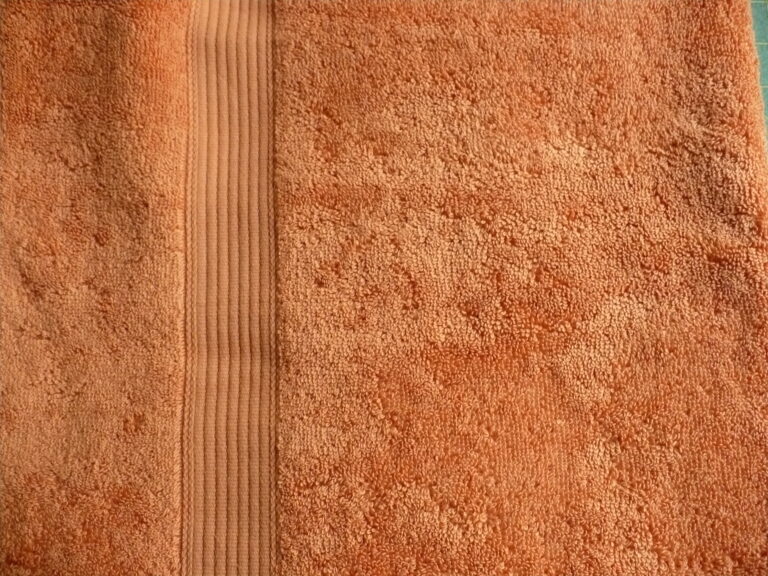 Orange textured towel with striped pattern