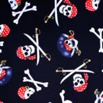 Pirate skulls and crossbones pattern on fabric.
