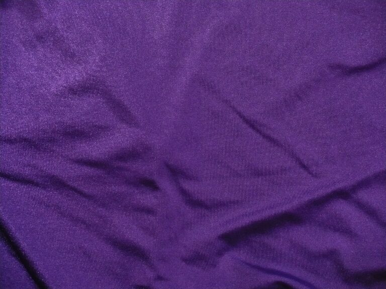 Purple fabric with subtle folds and wrinkles