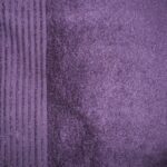 Purple textured fabric with vertical stripes.