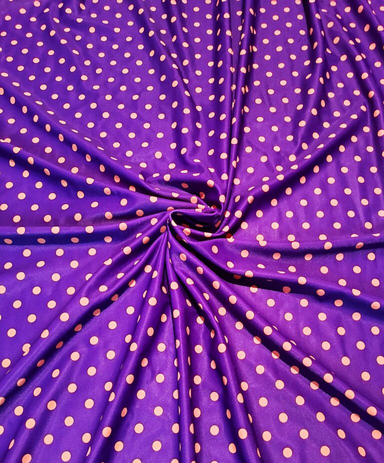 Purple fabric with orange polka dot pattern