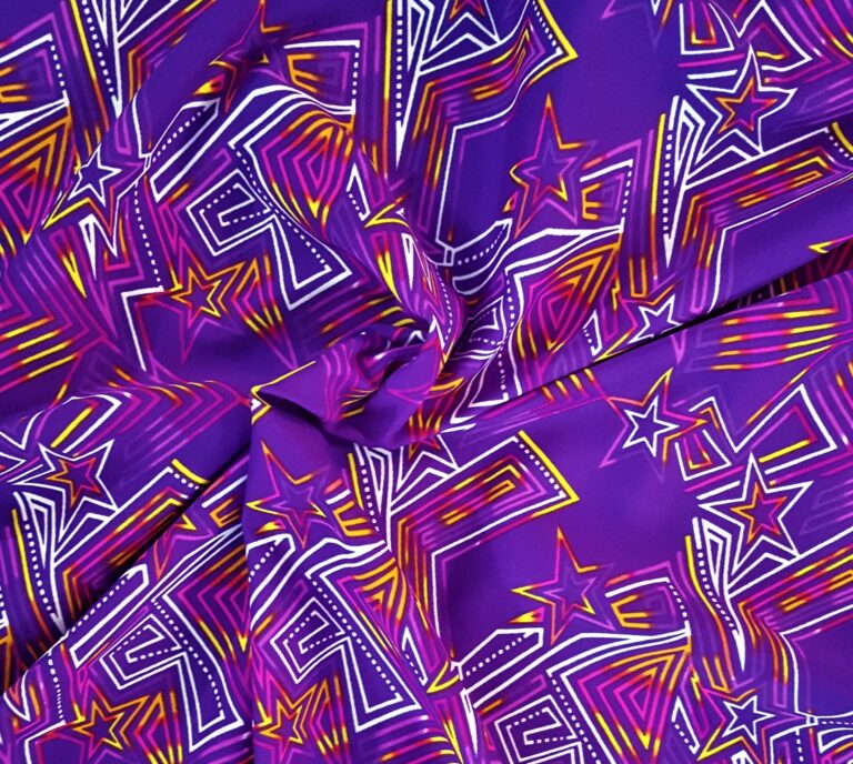 Purple fabric with colorful geometric star patterns