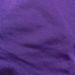 Purple fabric texture with soft folds.